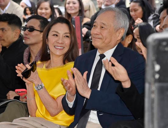 Actress Michelle Yeoh (L) and director And Lee react to comments during an unveiling ceremony honoring her with the 2,836th star on the Hollywood Walk of Fame in Los Angeles on Wednesday, February 18, 2026.  LAP2026021822 JIMxRUYMEN