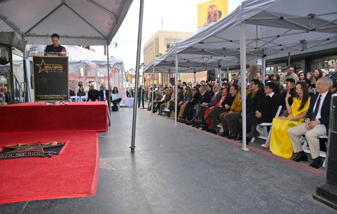 Director Jon M. Chu makes comments during the Hollywood Walk of Fame unveiling ceremony honoring Michelle Yeoh (in yellow) with the 2,836th star on the Hollywood Walk of Fame in Los Angeles on Wednesday, February 18, 2026.  LAP2026021830 JIMxRUYMEN