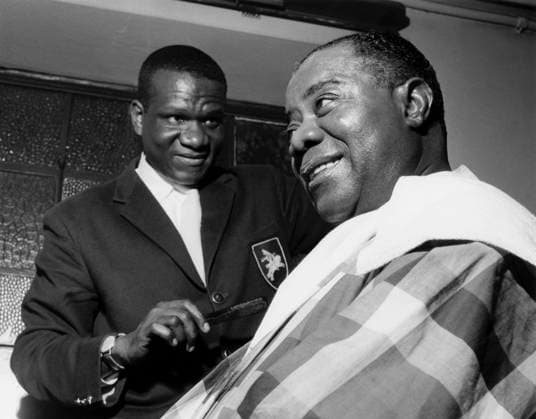 RECORD DATE NOT STATED Louis Armstrong having his haircut in Hammersmith, London 1962 Photo by Brian Foskett EDITORIAL USE ONLY  Copyright: NationalxJazzxArchivex