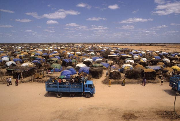 Somalia Famine and Civil War Aug 20, 1992; Liboi, KENYA; Trucks arrive bringing the latest Somalis fleeing the famine and war in their country to the temporary shelter at the UNHCR refugee camp in Liboi, Kenya, 700 kilometers from Nairobi. Most of the refugees came by foot. Most of the Somalis in the camp are from the Darod clan. Mandatory Credit: Photo by Cheryl Hatch ZUMA Press. ( ) Copyright 1992 by Cheryl Hatch Liboi KENYA Copyright: xCherylxHatchx