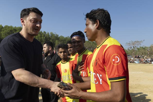 TIKA delegation joins football event in Cox’s Bazar COX S BAZAR, BANGLADESH - FEBRUARY 19: Renowned Turkish football star Mesut Ozil meets athletes during a football tournament organized by TIKA along with Chairman of the Board of Trustees of the Ilim Yayma Foundation, Necmeddin Bilal Erdogan and President of the Turkish Cooperation and Coordination Agency (TIKA), Abdullah Eren in Cox s Bazar, Bangladesh on February 19, 2026. Ozil and Eren also joined the Rohingya participants on the field, playing football together and creating an atmosphere of joy and excitement. The field was filled with Rohingya children, youth, and local residents, making the event lively and festive. Abdul Goni Anadolu Cox s Bazar Bangladesh. Editorial use only. Ple  Copyright: x2026xAnadoluxAbdulxGonix