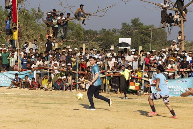 TIKA delegation joins football event in Cox’s Bazar COX S BAZAR, BANGLADESH - FEBRUARY 19: Renowned Turkish football star Mesut Ozil meets athletes during a football tournament organized by TIKA along with Chairman of the Board of Trustees of the Ilim Yayma Foundation, Necmeddin Bilal Erdogan and President of the Turkish Cooperation and Coordination Agency (TIKA), Abdullah Eren in Cox s Bazar, Bangladesh on February 19, 2026. Ozil and Eren also joined the Rohingya participants on the field, playing football together and creating an atmosphere of joy and excitement. The field was filled with Rohingya children, youth, and local residents, making the event lively and festive. Abdul Goni Anadolu Cox s Bazar Bangladesh. Editorial use only. Ple  Copyright: x2026xAnadoluxAbdulxGonix