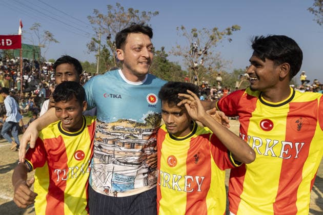 TIKA delegation joins football event in Cox’s Bazar COX S BAZAR, BANGLADESH - FEBRUARY 19: Renowned Turkish football star Mesut Ozil meets athletes during a football tournament organized by TIKA along with Chairman of the Board of Trustees of the Ilim Yayma Foundation, Necmeddin Bilal Erdogan and President of the Turkish Cooperation and Coordination Agency (TIKA), Abdullah Eren in Cox s Bazar, Bangladesh on February 19, 2026. Ozil and Eren also joined the Rohingya participants on the field, playing football together and creating an atmosphere of joy and excitement. The field was filled with Rohingya children, youth, and local residents, making the event lively and festive. Abdul Goni Anadolu Cox s Bazar Bangladesh. Editorial use only. Ple  Copyright: x2026xAnadoluxAbdulxGonix