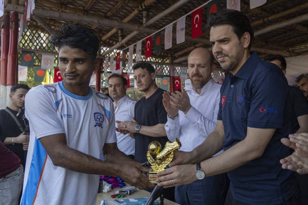 TIKA delegation joins football event in Cox’s Bazar COX S BAZAR, BANGLADESH - FEBRUARY 19: Renowned Turkish football star Mesut Ozil meets athletes during a football tournament organized by TIKA along with Chairman of the Board of Trustees of the Ilim Yayma Foundation, Necmeddin Bilal Erdogan and President of the Turkish Cooperation and Coordination Agency (TIKA), Abdullah Eren in Cox s Bazar, Bangladesh on February 19, 2026. Ozil and Eren also joined the Rohingya participants on the field, playing football together and creating an atmosphere of joy and excitement. The field was filled with Rohingya children, youth, and local residents, making the event lively and festive. Abdul Goni Anadolu Cox s Bazar Bangladesh. Editorial use only. Ple  Copyright: x2026xAnadoluxAbdulxGonix