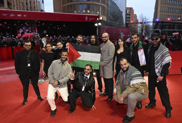 76th Berlin International Film Festival BERLIN, GERMANY - FEBRUARY 21: Actors take the stage carrying the Palestinian flag after winning the Best Feature Film Award with his film Chronicles From the Siege at the 76th Berlin International Film Festival (Berlinale) in Berlin, Germany, on February 21, 2026. Halil Sagirkaya Anadolu Berlin Germany. Editorial use only. Please get in touch for any other usage.  Copyright: x2026xAnadoluxHalilxSagirkayax