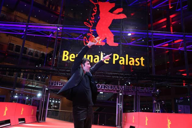February 21, 2026, Berlin, Germany: German film director and screenwriter Ilker Catak poses with the Golden Bear for Best Film for Gelbe Briefe (Yellow Letters) after the closing ceremony of the 76th Berlin International Film Festival (Berlinale), Europe s first major film festival of the year, in Berlin. The festival runs from February 12 to 22, 2026. Berlin Germany - ZUMAf146 20260221_zip_f146_002 Copyright: xRouzbehxFouladix