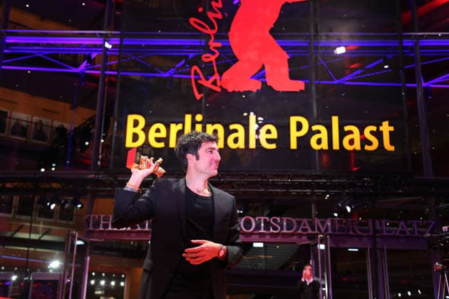 February 21, 2026, Berlin, Germany: German film director and screenwriter Ilker Catak poses with the Golden Bear for Best Film for Gelbe Briefe (Yellow Letters) after the closing ceremony of the 76th Berlin International Film Festival (Berlinale), Europe s first major film festival of the year, in Berlin. The festival runs from February 12 to 22, 2026. Berlin Germany  - ZUMAf146 20260221_zip_f146_003 Copyright: xRouzbehxFouladix