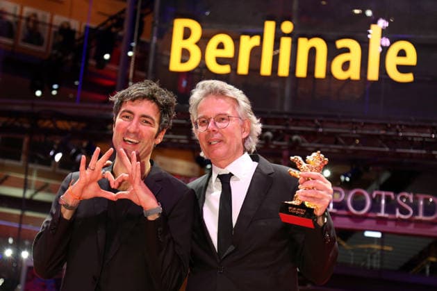 February 21, 2026, Berlin, Germany: German film director and screenwriter Ilker Catak (L) and Movie producer Ingo Fliess pose with the Golden Bear for Best Film for Gelbe Briefe (Yellow Letters) after the closing ceremony of the 76th Berlin International Film Festival (Berlinale), Europe s first major film festival of the year, in Berlin. The festival runs from February 12 to 22, 2026. Berlin Germany  - ZUMAf146 20260221_zip_f146_004 Copyright: xRouzbehxFouladix