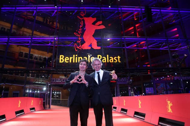 February 21, 2026, Berlin, Germany: German film director and screenwriter Ilker Catak (L) and Movie producer Ingo Fliess pose with the Golden Bear for Best Film for Gelbe Briefe (Yellow Letters) after the closing ceremony of the 76th Berlin International Film Festival (Berlinale), Europe s first major film festival of the year, in Berlin. The festival runs from February 12 to 22, 2026. Berlin Germany  - ZUMAf146 20260221_zip_f146_006 Copyright: xRouzbehxFouladix