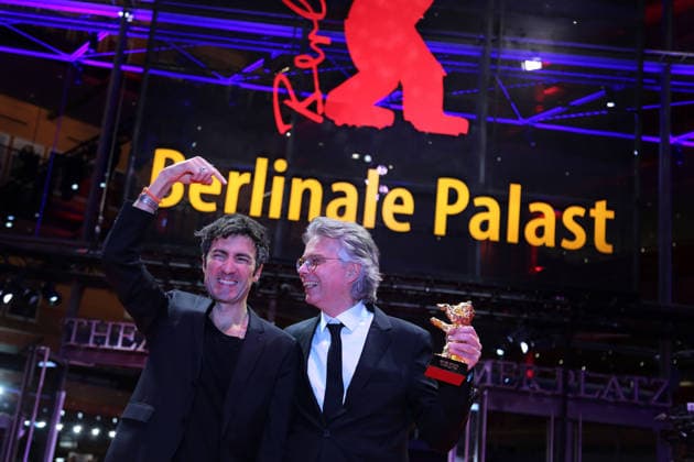 February 21, 2026, Berlin, Germany: German film director and screenwriter Ilker Catak (L) and Movie producer Ingo Fliess pose with the Golden Bear for Best Film for Gelbe Briefe (Yellow Letters) after the closing ceremony of the 76th Berlin International Film Festival (Berlinale), Europe s first major film festival of the year, in Berlin. The festival runs from February 12 to 22, 2026. Berlin Germany  - ZUMAf146 20260221_zip_f146_013 Copyright: xRouzbehxFouladix