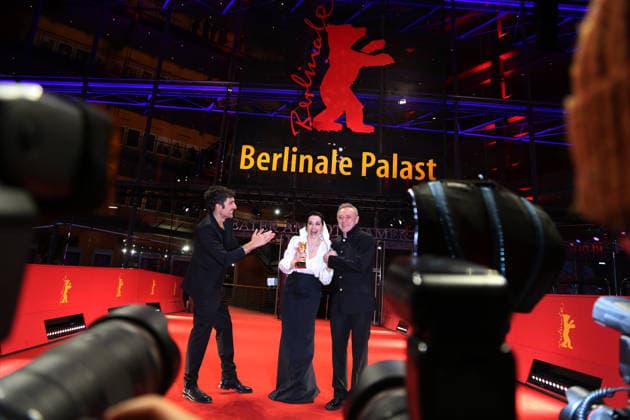 February 21, 2026, Berlin, Germany: (L-R) Ilker Catak, Ozgu Namal, and Tansu Bicer pose with the Golden Bear for Best Film for Gelbe Briefe (Yellow Letters) after the closing ceremony of the 76th Berlin International Film Festival (Berlinale), Europe s first major film festival of the year, in Berlin. The festival runs from February 12 to 22, 2026. Berlin Germany  - ZUMAf146 20260221_zip_f146_018 Copyright: xRouzbehxFouladix