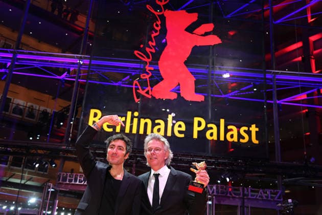 February 21, 2026, Berlin, Germany: German film director and screenwriter Ilker Catak (L) and Movie producer Ingo Fliess pose with the Golden Bear for Best Film for Gelbe Briefe (Yellow Letters) after the closing ceremony of the 76th Berlin International Film Festival (Berlinale), Europe s first major film festival of the year, in Berlin. The festival runs from February 12 to 22, 2026. Berlin Germany - ZUMAf146 20260221_zip_f146_020 Copyright: xRouzbehxFouladix