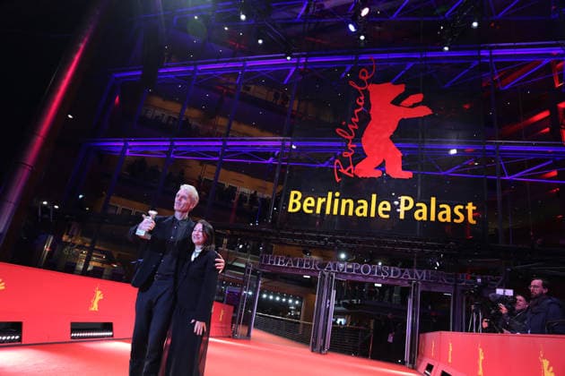 February 21, 2026, Berlin, Germany: Grant Gee (L) and Janine Marmot pose with the Silver Bear for Best Director for Everybody Digs Bill Evans after the closing ceremony of the 76th Berlin International Film Festival (Berlinale), Europe s first major film festival of the year, in Berlin. The festival runs from February 12 to 22, 2026. Berlin Germany - ZUMAf146 20260221_zip_f146_040 Copyright: xRouzbehxFouladix