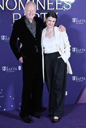 Swedish actor Stellan Skarsgard and American writer Megan Everett Skarsgard attend the BAFTA Film Awards Nominees Party at the National Gallery in London, England on Saturday, February 21, 2026.  LON20260221142 RUNExHELLESTAD