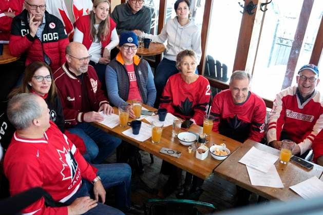 February 22, 2026, Chelsea, Pq, CAN: Prime Minister Mark Carney and his wife Diana Fox Carney watch the gold medal men s ice hockey game between Canada and the United States at the 2026 Milan Cortina Winter Olympics, with family and friends at a pub in Chelsea, Que., on Sunday, Feb. 22, 2026. Chelsea CAN  - ZUMAc35_ 20260222_zaf_c35_045 Copyright: xJustinxTangx