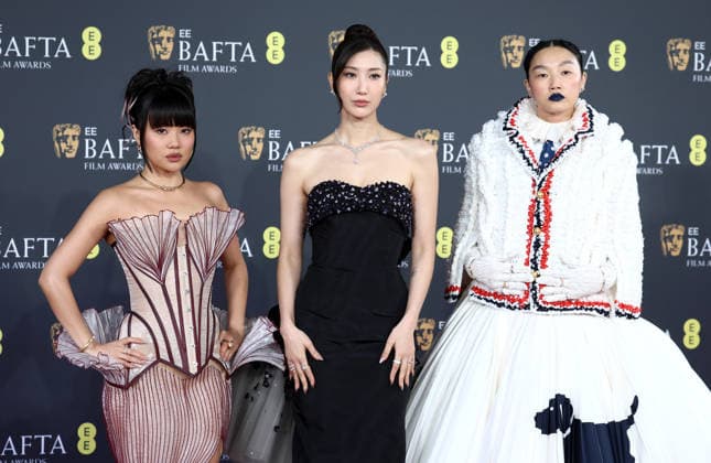 February 22, 2026, London, United Kingdom: Rei Ami, EJAE and Audrey Nuna attend the 2026 EE BAFTA Film Awards at The Royal Festival Hall, London United Kingdom  - ZUMAs197 20260222_aaa_s197_114 Copyright: xFredxDuvalx
