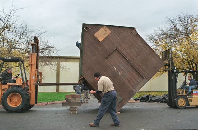 Montana Cabin of Unabomber Ted Kaczynski Dec 05, 1997; Sacramento, CA, USA; US Rentals employee Derrick Torres (middle) watches as fellow employees and forklift operators Dale Hucklebridge (left) and Kevin Willy (right) upright the Montana cabin of Unabomber Ted Kaczynski before being put into a warehouse for storage friday 12 5 97 at Mather Field. The cabin finally made its way to Sacramento after its trip across the west. It arrived at Matherapprox 11:45am. Sacramento CA USA Copyright: xChrisxCrewell SacramentoxBeex