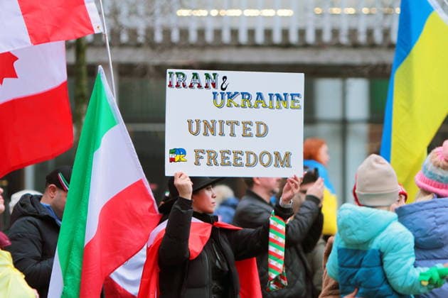 February 22, 2026, Vancouver, Bc, Canada: A woman holding Placard in Global Rally For Ukraine.Global Rally For Ukraine marking four years since Russia s full-scale invasion,taking place on February 22 at 2:00 PM at the vancouver Art Gallery. Vancouver Canada  - ZUMAa223 20260222_zip_a223_003 Copyright: xMazyarxAsadix