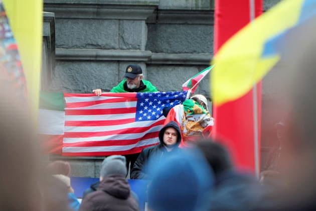 February 22, 2026, Vancouver, Bc, Canada: A man holding an american flag in Global Rally For Ukraine.Global Rally For Ukraine marking four years since Russia s full-scale invasion,taking place on February 22 at 2:00 PM at the vancouver Art Gallery. Vancouver Canada - ZUMAa223 20260222_zip_a223_004 Copyright: xMazyarxAsadix