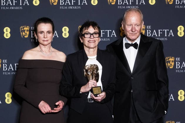 EE BAFTA Film Awards 2026 on Sunday 22 February 2026 Clare Binns with Emily Watson and Stellan Skarsgard poses in the press room at the EE BAFTA Film Awards 2026 on Sunday 22 February 2026 at Royal Festival Hall, London. Clare Binns with Emily Watson and Stellan Skarsgard is pictured with the award for Outstanding British Contribution to Cinema., Credit:Julie Edwards Avalon  Copyright: xJuliexEdwardsx xAvalonx 1077608467
