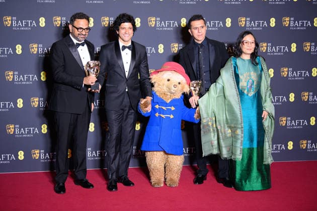 EE BAFTA Film Awards 2026 Winners - Royal Festival Hall, Southbank, London Paddington Bear (C) poses with (L to R) Alan McAlex, Farhan Akhtar, Lakshmipriya Devi and Ritesh Sidhwani pose with their BAFTA for Best Children and Family Film award for Boong in the Winners Room at the EE BAFTA Film Awards 2026 at Royal Festival Hall, Southbank in London, England, UK on Sunday 22 February, 2026., Credit:Justin Ng Avalon UK, England, London, Royal Festival Hall, Southbank Copyright: xJustinxNgx xAvalonx 1077638409