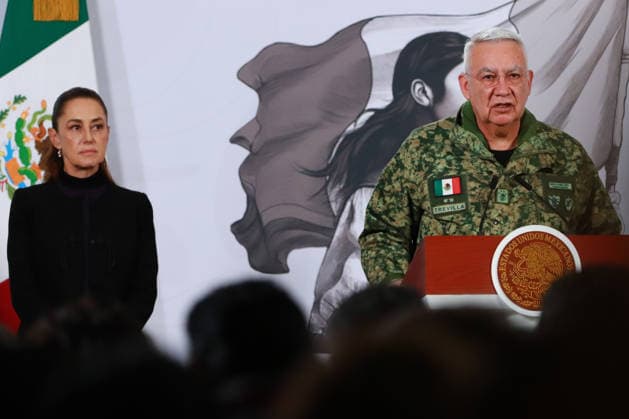 Mexico™s President Claudia Sheinbaum Holds El Mencho News Conference Mexico™s President Claudia Sheinbaum Pardo is seen behind while Minister of Mexican National Defense, Ricardo Trevilla Trejo speaking during a news conference about the death of Nemesio Oseguera, know El Mencho, leader of the Jalisco Nueva Generacion Cartel, during an operation in Tapalpa, Jalisco, which sparked roadblocks and vehicle burnings in various parts of the country. on February 23, 2026 in Mexico City, Mexico. (Photo by Carlos Santiago Eyepix Group) Copyright: xCarlosxSantiagox xEyepixxGroupx CS_23022026_176451