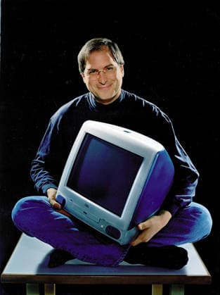 Steve Paul Jobs 1955-2011 Co-Founder of Apple Computer Feb. 19, 1999 - Cupertino, California, U.S. - Apple founder and current chief STEVE JOBS, cross legged and smiling as he holds the iMac that has become the hottest-selling computer on the market. The computer now comes in five fruit-inspired colors including blueberry and strawberry. Shown is the original Bondai Blue color. Copyright: xApplexComputerx