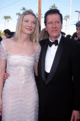 Actress Cate Blanchett Mar 07, 1999; Los Angeles, CA, USA; Actress CATE BLANCHETT and actor GEOFFREY RUSH at the 1999 SAG Awards held at Shrine Theater. She is wearing a white dress with see-through mesh lace shoulders. Hollywood California USA Copyright: xKathyxHutchinsx