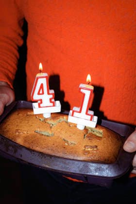 Homemade cake with birthday candles in baking tray during celebration model released, Symbolfoto, RDTF00558