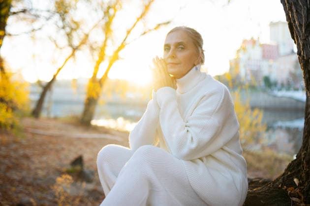 Woman in white turtleneck enjoying a peaceful autumn morning outdoors model released, Symbolfoto, VCF01271