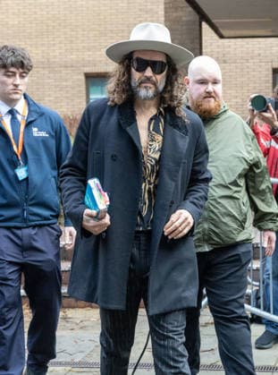 February 24, 2026, London, England, United Kingdom: RUSSELL BRAND leaves Southwark Crown Court where he is accused of two further sex offences, including rape, against two further women which allegedly took place in 2009. Brand is already facing allegations of sexual offences against four other women and is due to go on trial in June 2026. London United Kingdom - ZUMAs262 20260224_zip_s262_017 Copyright: xTayfunxSalcix
