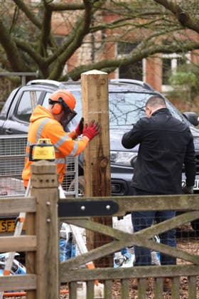 A press photographer watches as workers continues to install fencing around Marsh Farm. Marsh Farm is just along the road from Wood Farm on the Sandringham Estate where Andrew Mountbatten-Windsor is staying. Mountbatten-Windsor was arrested last week, and taken to Aylsham police station before being released under investigation, and returning to Wood Farm. Andrew Mountbatten-Windsor, formerly Prince Andrew The Duke of York, has previously denied any wrongdoing in relation to sex offender Jeffrey Epstein. Andrew Mountbatten-Windsor, Sandringham, Norfolk, on 25th February, 2026 