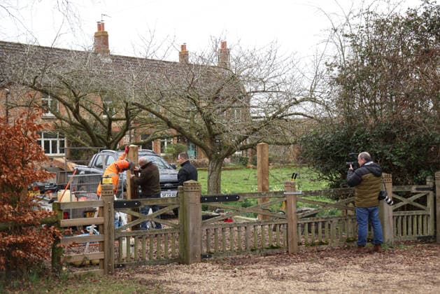 A press photographer watches as workers continues to install fencing around Marsh Farm. Marsh Farm is just along the road from Wood Farm on the Sandringham Estate where Andrew Mountbatten-Windsor is staying. Mountbatten-Windsor was arrested last week, and taken to Aylsham police station before being released under investigation, and returning to Wood Farm. Andrew Mountbatten-Windsor, formerly Prince Andrew The Duke of York, has previously denied any wrongdoing in relation to sex offender Jeffrey Epstein. Andrew Mountbatten-Windsor, Sandringham, Norfolk, on 25th February, 2026 