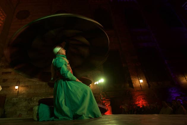 The traditional Ramadan custom Tennura dance in Egypt CAIRO, EGYPT - FEBRUARY 25: Tennura dance performances and Sufi music concerts are held daily throughout the holy month of Ramadan at Bayt al-Ghuri in Cairo on February 25, 2026. Wearing colorful skirts, embroidered vests, and white caps, Tennura performers spin around their axis while playing tambourines in rhythm with Sufi music, creating a vibrant and spiritual spectacle. Fareed Kotb Anadolu Cairo Egypt. Editorial use only. Please get in touch for any other usage.  Copyright: x2026xAnadoluxFareedxKotbx