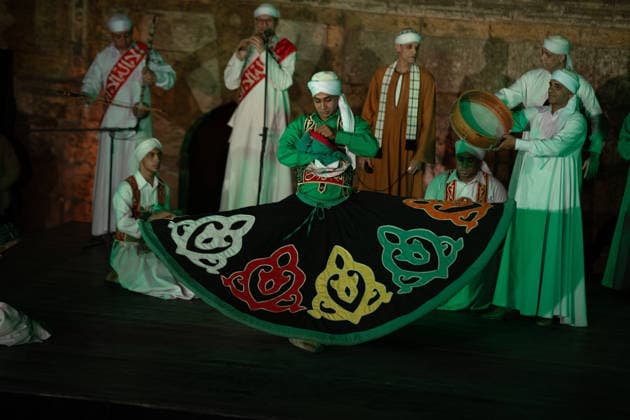 The traditional Ramadan custom Tennura dance in Egypt CAIRO, EGYPT - FEBRUARY 25: Tennura dance performances and Sufi music concerts are held daily throughout the holy month of Ramadan at Bayt al-Ghuri in Cairo on February 25, 2026. Wearing colorful skirts, embroidered vests, and white caps, Tennura performers spin around their axis while playing tambourines in rhythm with Sufi music, creating a vibrant and spiritual spectacle. Fareed Kotb Anadolu Cairo Egypt. Editorial use only. Please get in touch for any other usage.  Copyright: x2026xAnadoluxFareedxKotbx