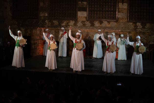 The traditional Ramadan custom Tennura dance in Egypt CAIRO, EGYPT - FEBRUARY 25: Tennura dance performances and Sufi music concerts are held daily throughout the holy month of Ramadan at Bayt al-Ghuri in Cairo on February 25, 2026. Wearing colorful skirts, embroidered vests, and white caps, Tennura performers spin around their axis while playing tambourines in rhythm with Sufi music, creating a vibrant and spiritual spectacle. Fareed Kotb Anadolu Cairo Egypt. Editorial use only. Please get in touch for any other usage.  Copyright: x2026xAnadoluxFareedxKotbx