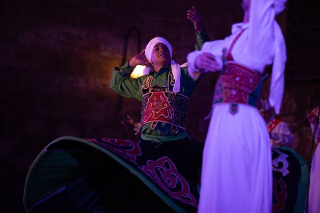 The traditional Ramadan custom Tennura dance in Egypt CAIRO, EGYPT - FEBRUARY 25: Tennura dance performances and Sufi music concerts are held daily throughout the holy month of Ramadan at Bayt al-Ghuri in Cairo on February 25, 2026. Wearing colorful skirts, embroidered vests, and white caps, Tennura performers spin around their axis while playing tambourines in rhythm with Sufi music, creating a vibrant and spiritual spectacle. Fareed Kotb Anadolu Cairo Egypt. Editorial use only. Please get in touch for any other usage.  Copyright: x2026xAnadoluxFareedxKotbx