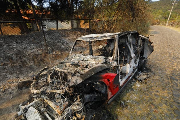 Life in Tapalpa after military operation that killed cartel leader El Mencho TAPALPA, MEXICO - FEBRUARY 25: A view of burned cars after a military operation that killed cartel leader Nemesio Oseguera, El Mencho , in Tapalpa, Mexico. on February 25, 2026. Stringer Anadolu Tapalpa Mexico. Editorial use only. Please get in touch for any other usage.  Copyright: x2026xAnadoluxStringerx