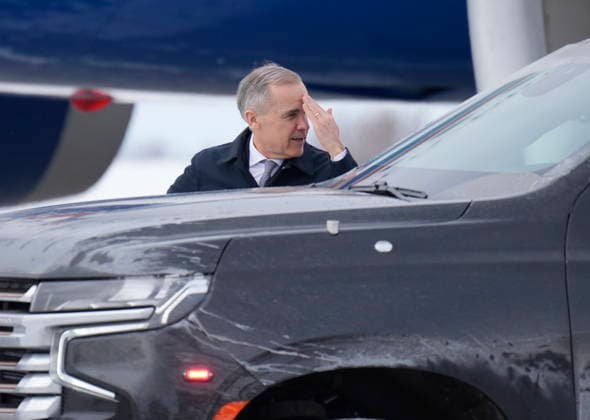 February 26, 2026, Ottawa, On, Canada: Prime Minister Mark Carney says farewell as he exits his vehicle and makes his way to a government plane in Ottawa on Thursday, Feb. 26, 2026. Ottawa Canada  - ZUMAc35_ 20260226_zaf_c35_007 Copyright: xAdrianxWyldx