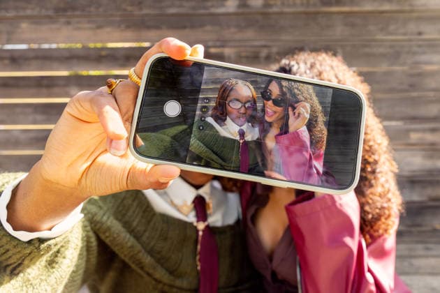 Gen Z friends taking a selfie during urban outing Two friends capture a joyful selfie outdoors, reflecting the vibrant urban lifestyle of Gen Z. Their playful expressions and fashionable style highlight modern friendship. Model Released GemaAlejo_ID33257_1132304_004 Copyright: xGemaxAlejox RECORD DATE NOT STATED