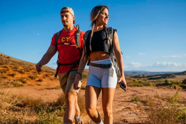Two hikers explore a Red Canyon in Spain A couple hikes through the stunning Red Canyon of Spain, enjoying the breathtaking landscapes and the promise of adventure. Clear blue skies highlight their thrilling journey. Model Released JoseLuisCarrascosa_ID32450_1105890_197 Copyright: xJosexLuisxCarrascosax RECORD DATE NOT STATED