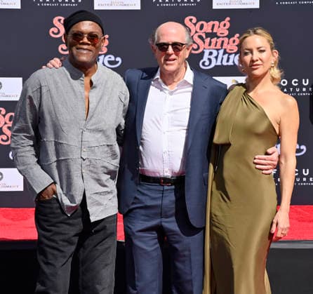 US actors Samuel L. Jackson (L) and Kate Hudson (R) participates in a hand and footprint ceremony immortalizing producer John Davis (C) in the forecourt of the TCL Chinese Theatre (formerly Grauman s) in the Hollywood section of Los Angeles on Thursday, February 26, 2026.  LAP2026022608 JIMxRUYMEN