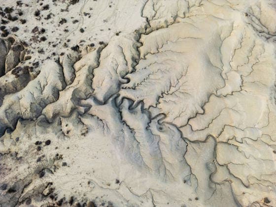 Aerial view of striking desert geological formations Aerial photograph capturing dramatic desert terrain, showcasing intricate patterns and eroded formations. The image highlights nature s artistic imprint on a barren landscape. Model Released MiguelCano_ID33886_1193318_013 Copyright: xMiguelxCanox RECORD DATE NOT STATED