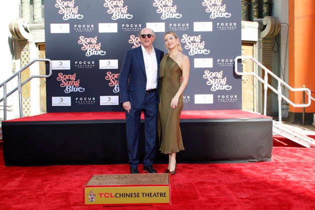 February 26, 2026, Los Angeles, California, USA: John Davis, Kate Hudson at a ceremony honoring producer John Davis with hand and foot prints at the TCL Chinese Theatre IMAX. Los Angeles USA - ZUMAg107 20260226_zep_g107_043 Copyright: xNinaxPrommerx