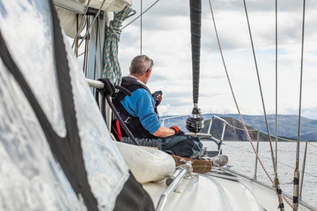 Man Sailing in Norway Scenic Waters A man enjoys a serene sailing experience on a boat in Norway, surrounded by picturesque landscapes and calm waters, highlighting the beauty of nautical adventure. Model Released Robcabphotography_ID33062_1125378_044 Copyright: xRobcabphotographyx RECORD DATE NOT STATED