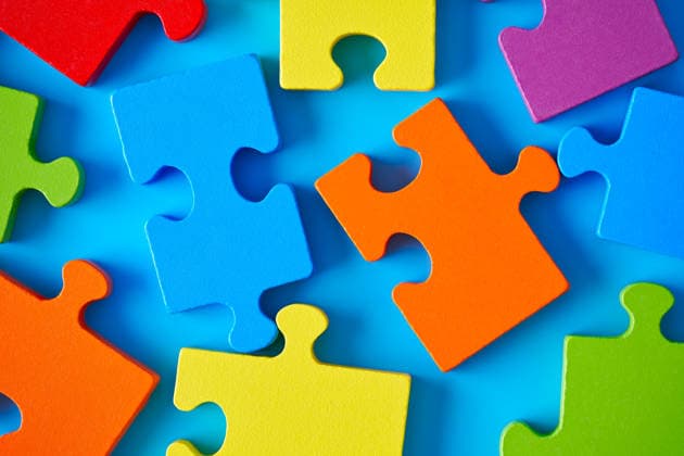 Colorful jigsaw pieces symbolizing autistic disorder Vibrant jigsaw puzzle pieces scattered on a blue surface symbolizing autism and mental development. The pieces represent complexity, strategy, and brain health. Model Released Zhenikeyev_ID33161_1129147_002 Copyright: xZhenikeyevx RECORD DATE NOT STATED