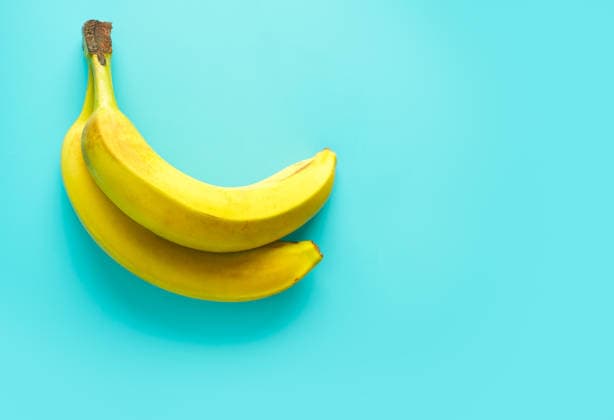 Fresh bananas with vibrant blue background Two ripe yellow bananas placed diagonally on a vibrant blue background, creating a striking contrast. The composition highlights the fruit s freshness and appealing texture. Model Released Zhenikeyev_ID33354_1165273_001 Copyright: xZhenikeyevx RECORD DATE NOT STATED