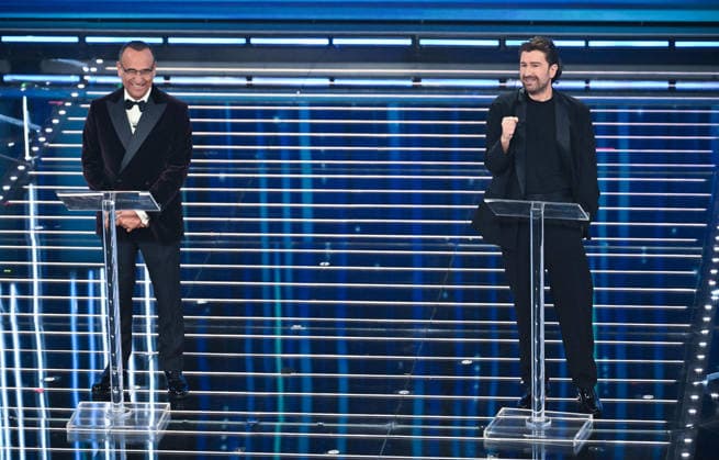 February 27, 2026, Sanremo, Italy: (L-R) Sanremo Festival host and artistic director Carlo Conti with Italian actor Alessandro Siani on stage at the Ariston theatre during the 76th edition of the Sanremo Italian Song Festival, in Sanremo, Italy, 27 February 2026. The music festival will run from 24 to 28 February 2026. ANSA RICCARDO ANTIMIANI. Sanremo Italy  - ZUMAa110 20260227_zaf_a110_120 Copyright: xRiccardoxAntimianix