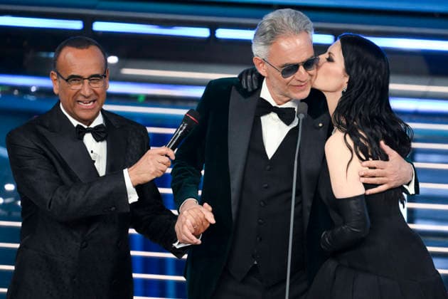February 28, 2026, Sanremo, Italy: (L-R) Sanremo Festival host and artistic director Carlo Conti with Italian tenor Andrea Bocelli and Italian singer Laura Pausini on stage at the Ariston theatre during the 76th edition of the Sanremo Italian Song Festival, in Sanremo, Italy, 28 February 2026. The music festival will run from 24 to 28 February 2026. ANSA ETTORE FERRARI. Sanremo Italy  - ZUMAa110 20260228_zaf_a110_230 Copyright: xEttorexFerrarix