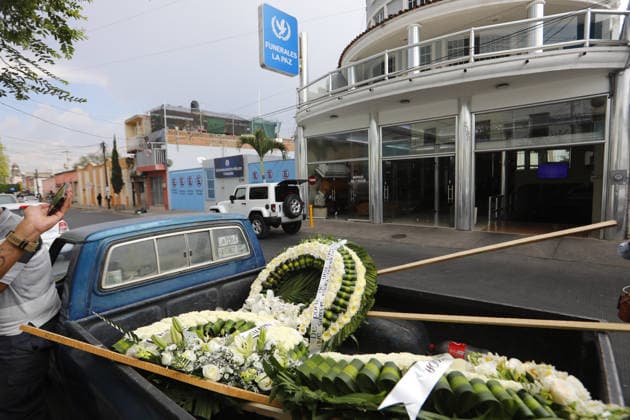 Funeral preparations are underway, believed to be for the slain cartel leader El Mencho in Guadalajara GUADALAJARA, MEXICO - MARCH 1: Employees unload a floral arrangement outside the La Paz funeral home as Mexican Army members take security measures near the funeral home, where the body of Nemesio Oseguera Cervantes, the leader of the Jalisco New Generation Cartel (CJNG) known as El Mencho , is believed to be located in Guadalajara, Jalisco, Mexico, on March 1, 2026. Stringer Anadolu Guadalajara Mexico. Editorial use only. Please get in touch for any other usage.  Copyright: x2026xAnadoluxStringerx
